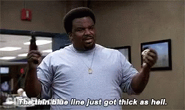 A Man In A Blue Shirt Is Holding A Bottle Of Beer And Says `` The Thin Blue Line Just Got Thick As Hell . '' GIF