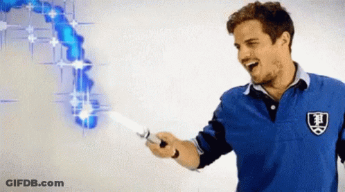 A Man In A Blue Shirt Is Holding A Knife With A Shield On It GIF