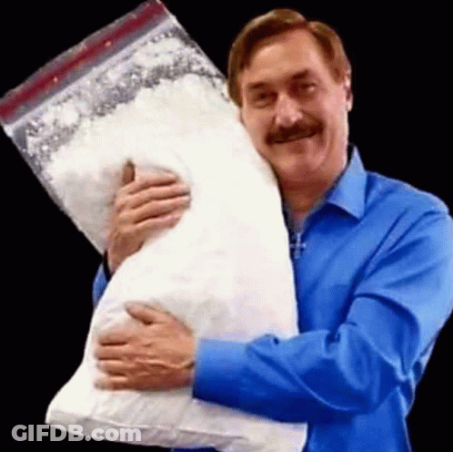 A Man In A Blue Shirt Is Holding A Large Bag Of Cocaine . GIF