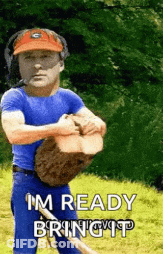 A Man In A Blue Shirt Is Holding A Log And Says I 'M Ready Bring It . GIF