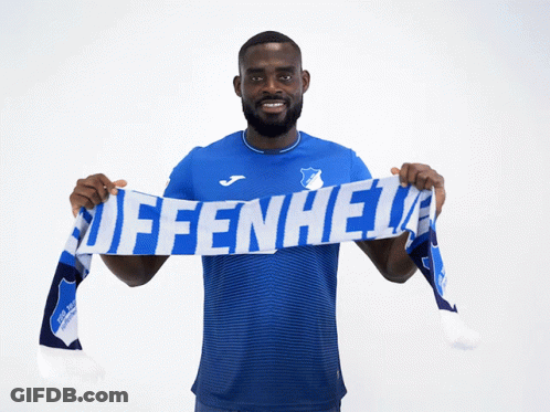 A Man In A Blue Shirt Is Holding A Scarf That Says Affenheid GIF