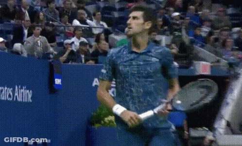 A Man In A Blue Shirt Is Holding A Tennis Racquet In Front Of A Sign That Says Rates Airline GIF