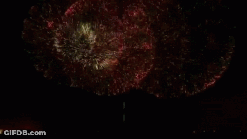 A Man In A Blue Shirt Is In A Circle With Butterflies GIF
