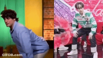 A Man In A Blue Shirt Is Kneeling Down Next To A Man In A Green And Green Striped Sweater . GIF