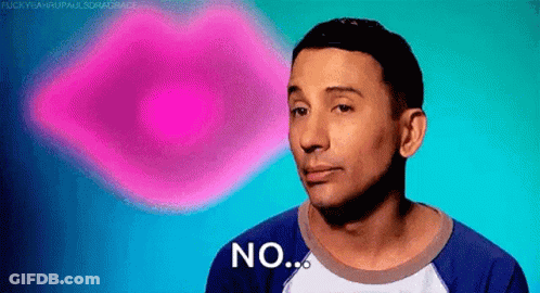 A Man In A Blue Shirt Is Making A Funny Face And Says No . GIF