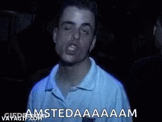 A Man In A Blue Shirt Is Making A Funny Face And Shouting Amsterdam . GIF