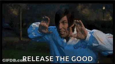 A Man In A Blue Shirt Is Making A Funny Face While Holding His Hands Up In Front Of His Face . GIF