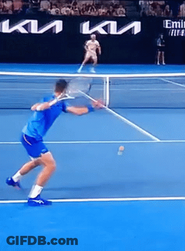 A Man In A Blue Shirt Is Playing Tennis On A Court Sponsored By Kia GIF