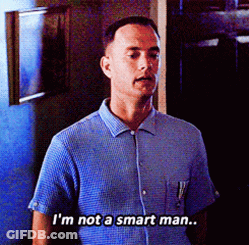 A Man In A Blue Shirt Is Saying That He Is Not A Smart Man GIF