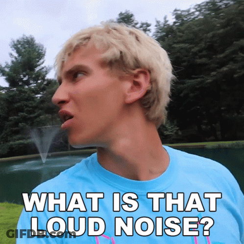 A Man In A Blue Shirt Is Saying What Is That Loud Noise GIF