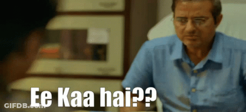 A Man In A Blue Shirt Is Sitting In A Hospital Bed And Says Ee Kaa Hai GIF