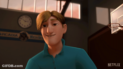 A Man In A Blue Shirt Is Smiling In Front Of A Sign That Says Arcadia On It GIF