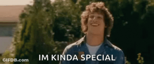 A Man In A Blue Shirt Is Smiling In Front Of Trees And The Words `` Im Kinda Special '' . GIF