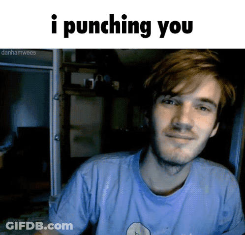 A Man In A Blue Shirt Is Smiling With The Words I Punching You Below Him GIF