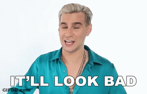 A Man In A Blue Shirt Is Smiling With The Words It 'Ll Look Bad Below Him GIF