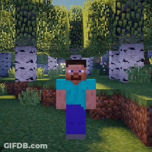 A Man In A Blue Shirt Is Standing In A Field Holding A White Object In His Hand GIF