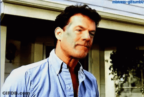 A Man In A Blue Shirt Is Standing In Front Of A House With The Words Mistress-Gif Tumblr Written On The Bottom GIF