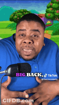 A Man In A Blue Shirt Is Standing In Front Of A Microphone With The Words Big Back Tiktok Below Him GIF