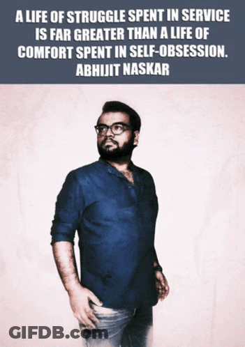 A Man In A Blue Shirt Is Standing In Front Of A Quote From Abhijit Naskar GIF