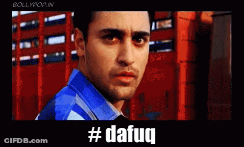 A Man In A Blue Shirt Is Standing In Front Of A Red Building With The Hashtag #Dafaq Written Below Him GIF