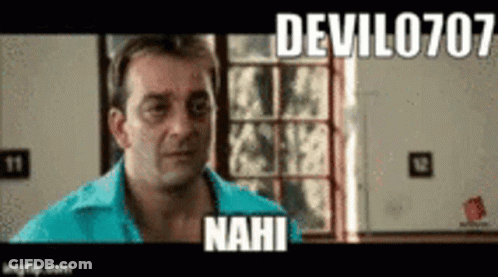 A Man In A Blue Shirt Is Standing In Front Of A Window And A Sign That Says Devil0707 Nahi . GIF