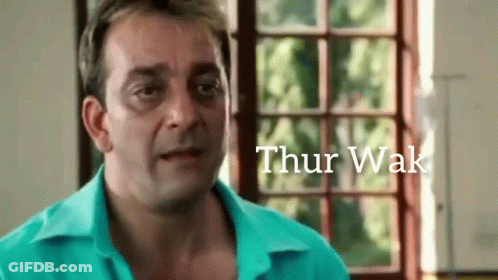 A Man In A Blue Shirt Is Standing In Front Of A Window With The Word Thur Wak Written On The Bottom GIF