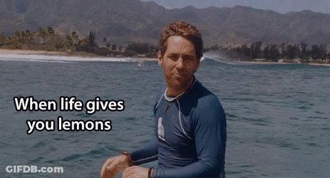 A Man In A Blue Shirt Is Standing In The Water With The Words " When Life Gives You Lemons " Written Below Him GIF