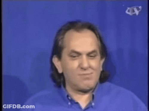 A Man In A Blue Shirt Is Standing Next To A Man In A White Shirt In Front Of A Cer Water Cooler GIF