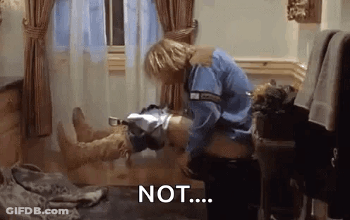 A Man In A Blue Shirt Is Standing Next To A Woman In A Bathtub With The Word Not Written On The Floor . GIF