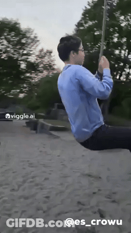 A Man In A Blue Shirt Is Swinging On A Rope With The Hashtag @Es_crowu Below Him GIF