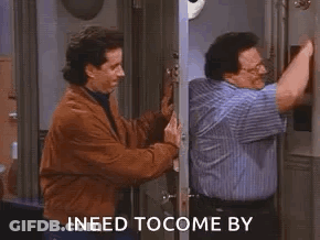 A Man In A Blue Shirt Is Talking To Another Man In A Brown Jacket . GIF