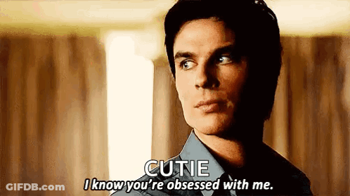 A Man In A Blue Shirt Is Talking To Another Man . GIF