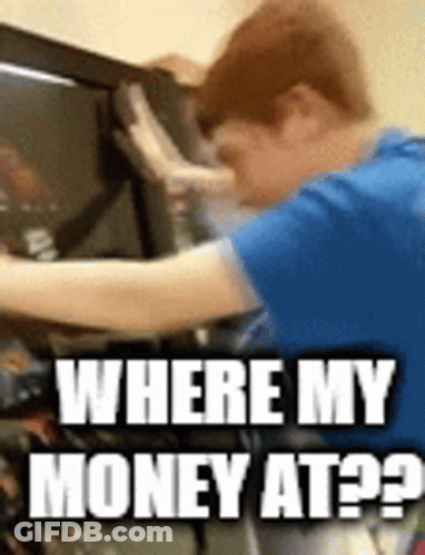 A Man In A Blue Shirt Is Working On A Computer And Asking Where His Money Is GIF