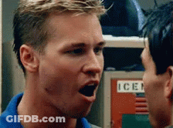 A Man In A Blue Shirt Is Yelling At Another Man In Front Of A Locker With The Word Ice On It GIF