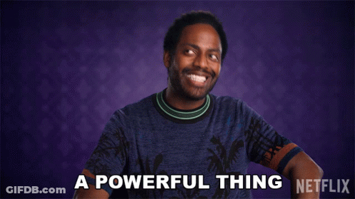 A Man In A Blue Shirt Says " A Powerful Thing " In Front Of A Purple Background GIF