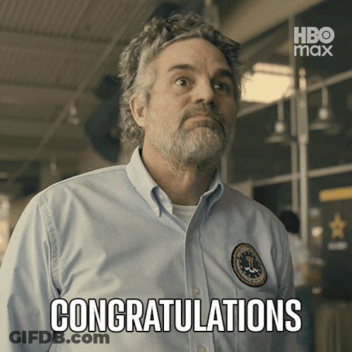 A Man In A Blue Shirt Says Congratulations In Front Of A Hbo Max Logo GIF