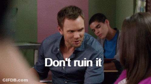 A Man In A Blue Shirt Says " Do N't Ruin It " While Sitting At A Desk GIF
