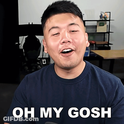 A Man In A Blue Shirt Says " Oh My Gosh " In White Letters GIF