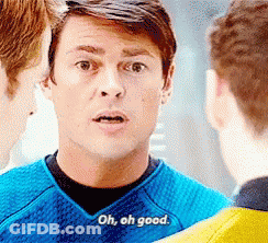 A Man In A Blue Shirt Says Oh , Oh Good While Talking To Two Other Men . GIF