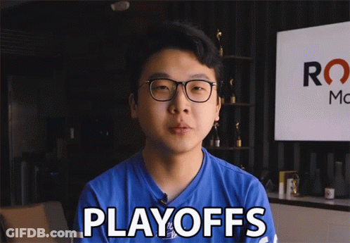 A Man In A Blue Shirt Says Playoffs In Front Of A Sign GIF