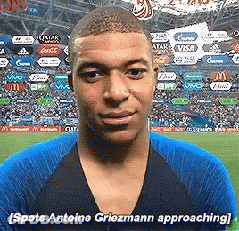 A Man In A Blue Shirt Says Spots Antoine Griezmann Approaching In Front Of A Crowd GIF