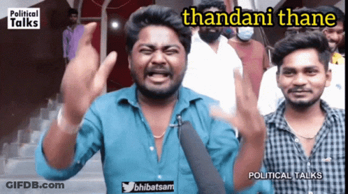 A Man In A Blue Shirt Says Thandani Thane In Front Of A Group Of People GIF