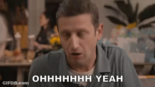 A Man In A Blue Shirt Says Yeah In White Letters GIF