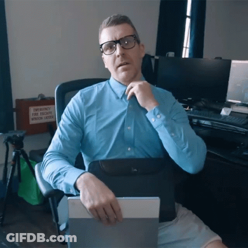 A Man In A Blue Shirt Sits In Front Of An Emergency Window Ladder GIF