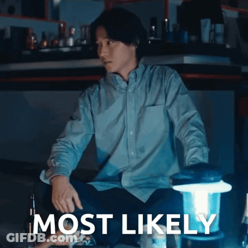 A Man In A Blue Shirt Sits Next To A Lantern With The Words Most Likely Written On The Bottom GIF