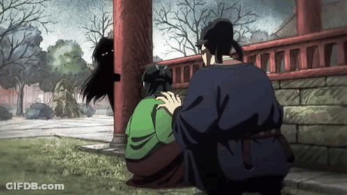 Man In Blue Shirt Next To Woman In Green Dress GIF