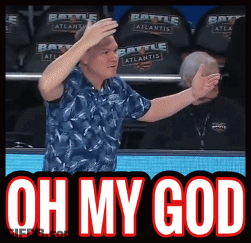 A Man In A Blue Shirt Stands In Front Of A Banner That Says Oh My God GIF