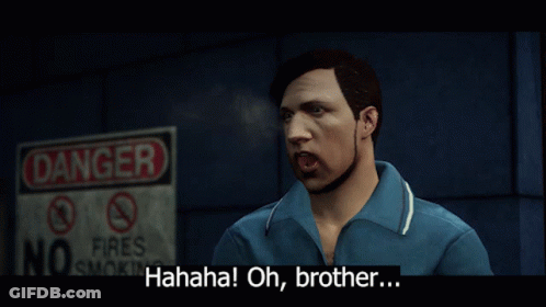 A Man In A Blue Shirt Stands In Front Of A Sign That Says Danger GIF