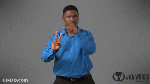 A Man In A Blue Shirt Stands In Front Of A Sign That Says " With Words " GIF