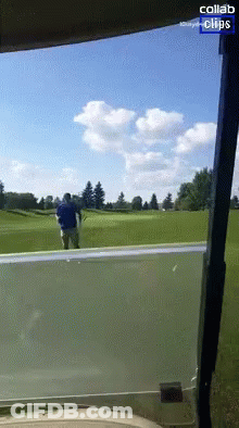 A Man In A Blue Shirt Stands On A Golf Course With The Words Collab Clips Below Him GIF